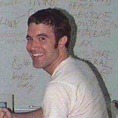 Tom smiling toward the camera in an early digital photograph